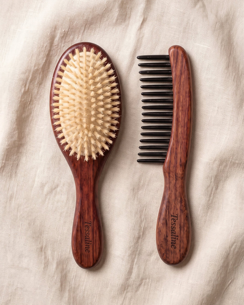 The Soft Grade boar bristle brush and a wide-tooth detangling comb, laid side by side on linen