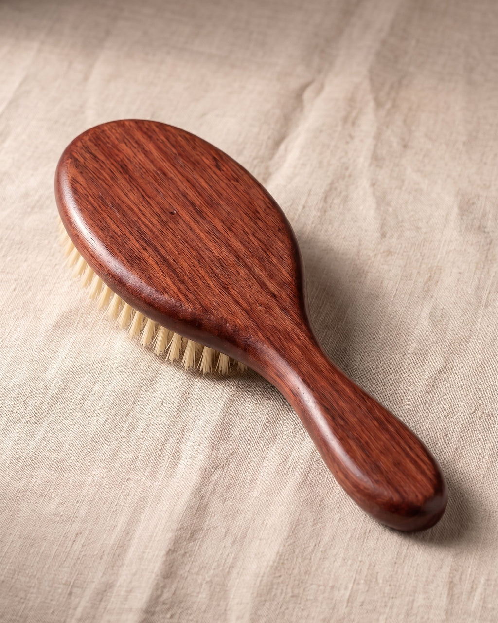 The wooden back and handle of The Soft Grade brush